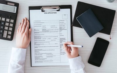 top-view-of-woman-holding-pen-near-document-with-v-3M3R2GM.jpg top-view-of-woman-holding-pen-near-document-with-v-3M3R2GM.jpg